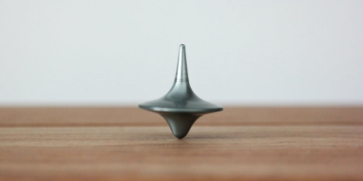 spinning-top-on-table
